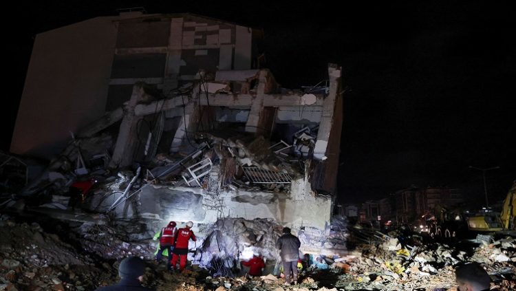 A rescue team works on a collapsed building, following an earthquake in Iskenderun, Türkiye February 6, 2023.