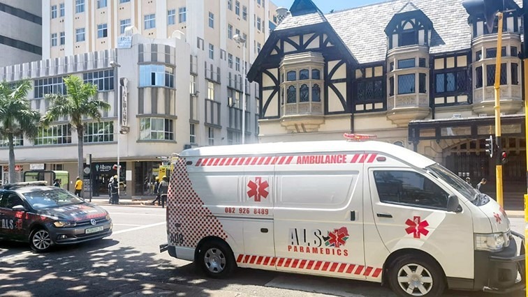 Ambulance parked in front of a building