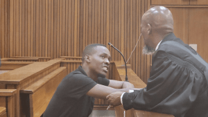 Bongani Ntanzi talking to the lawyer at the Meyiwa murder trial