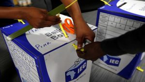IEC officials seal ballot boxes.