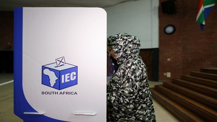 A woman casting her vote.