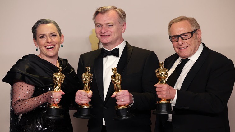 Nolan, Emma Thomas and Charles Roven pose with the Oscar for Best Picture for "Oppenheimer"