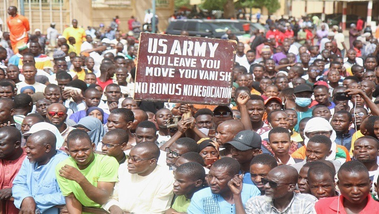 Nigeriens gather in a street to protest against the US military presence, in Niamey, Niger