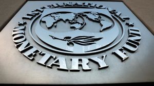 The International Monetary Fund (IMF) logo is seen outside the headquarters building in Washington, U.S.,